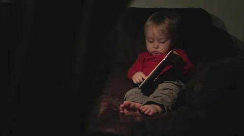 Toddler with tablet computer on the couch Stock Footage 59123909