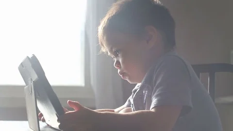 Toddler using electronic device, video Stock Footage 79720241