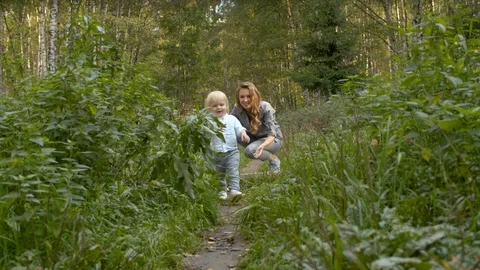 Toddler walking along the path Stock Footage 118704236