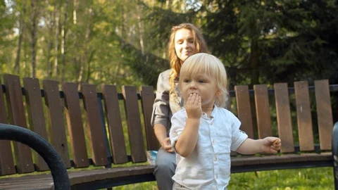 Toddler walking in the park Stock Footage 120596420