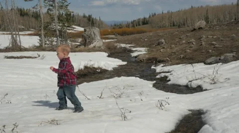Toddler Walking in the Snow Stock Footage 49682542