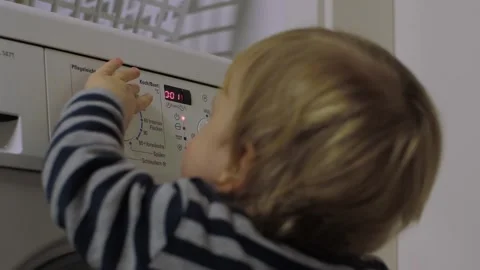 Toddler Washing Machine Controls Stock Footage 303499287