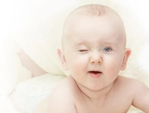 Toddler winking Foto stock