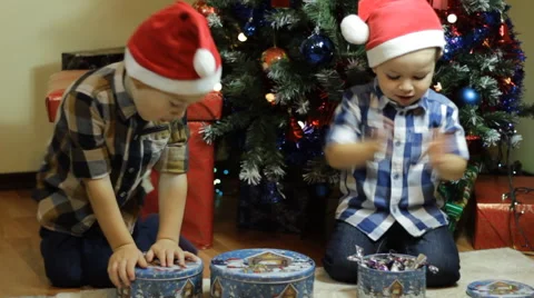 Toddlers with candy boxes on Christmas Stock Footage 57647261