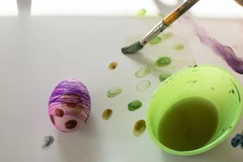Toddler's Easter egg creation process - dye, water color Stock Photos