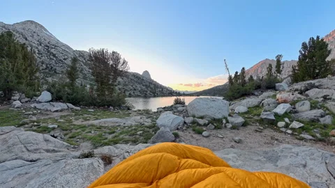 Toe of Sleeping Bag in Front of Lake Video stock 336234477