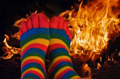 Toe socks by fire Stock Photos