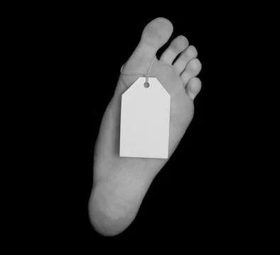 Toe tag isolated on black Stock Photos