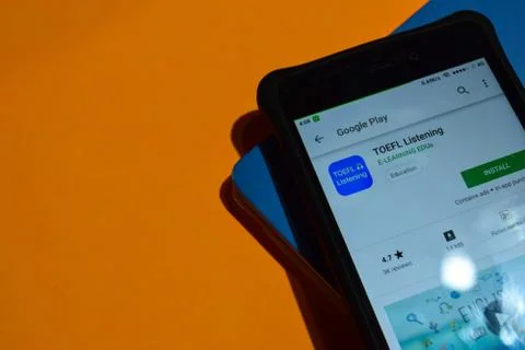TOEFL Listening dev app on Smartphone screen Stock Photos