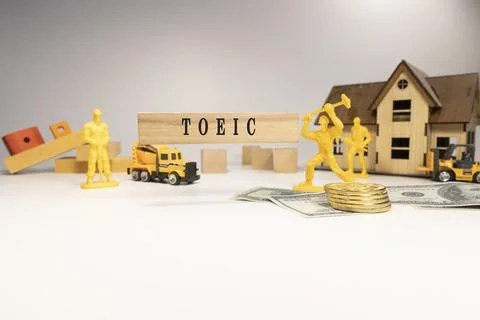 TOEIC text. It was taken in the studio written on a wooden frame. white bac.. Stock Photos