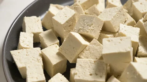 Tofu chunks closeup. Plant based diet. Vegan protein source Stock Footage 170260113