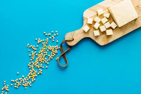 Tofu cubes with soybeans top view copy space Stock Photos