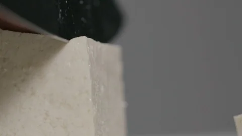 Tofu cut in slow motion Stock Footage 116898211