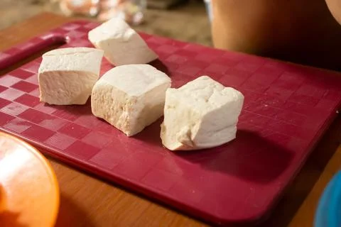 Tofu placed on a red plastic table Stock Photos