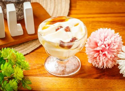 Tofu Pudding served in cup isolated on wooden table side view of Taiwan des.. Stock Photos