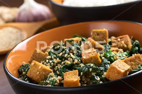 Tofu with spinach and sesame Stock Photos