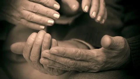 TOGETHER FOREVER two pairs of elderly hands in close up view. Stock Footage 296087146