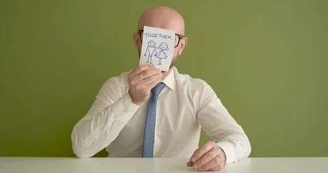 Together - A man presents a note with the word  Stock Footage 267089325