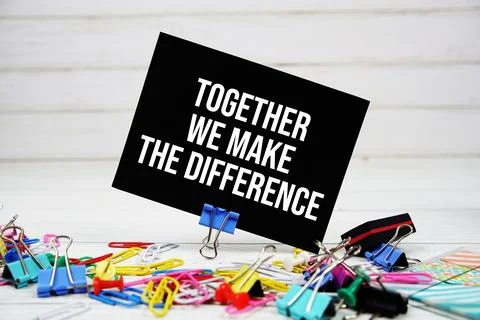 Together We Make The Difference text on paper card with stationary on woode.. Stock Photos