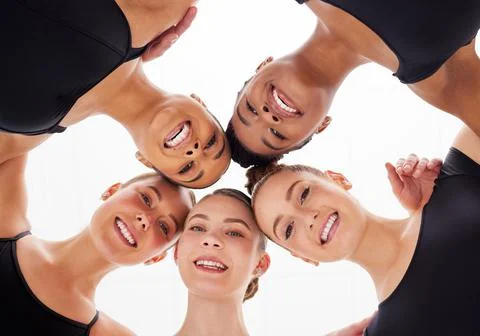 Together we uplift one another. a group of young female ballerinas in a huddle. Stock Photos