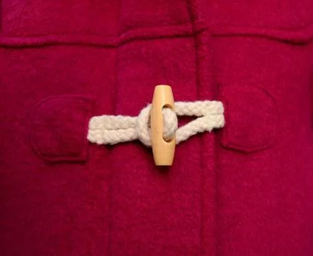 Toggle Button Toggle Button On A Red Duffle Coat Copyright: xZoonar.com/Pi... Stock Photos