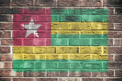 Togo flag on a brick wall background Stock Photos