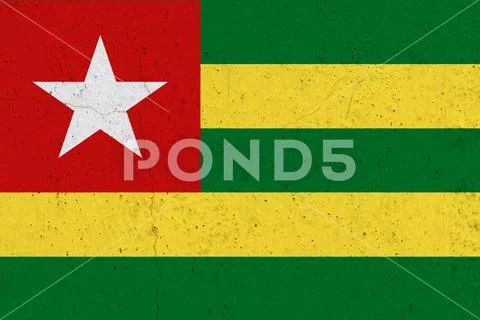 Togo flag on concrete wall Stock Photos