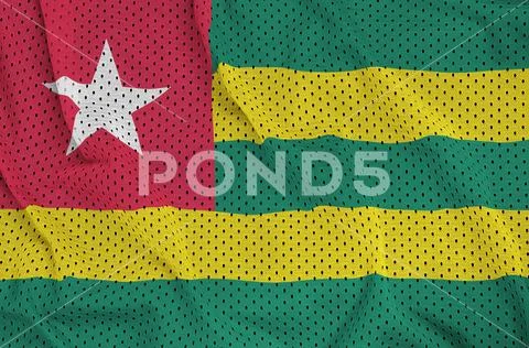Togo flag printed on a polyester nylon sportswear mesh fabric wi Stock Photos