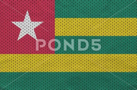 Togo flag printed on a polyester nylon sportswear mesh fabric wi Stock Photos