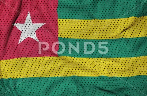 Togo flag printed on a polyester nylon sportswear mesh fabric wi Stock Photos