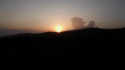 Togo Mountains: sunset back tracking dimn light; Drone 4K Stock Footage 282864978