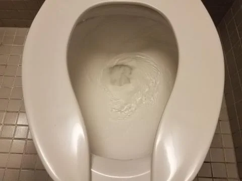 Toilet being flushed Stock Photos