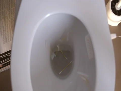 Toilet flush ear bud Stock Footage 80248239