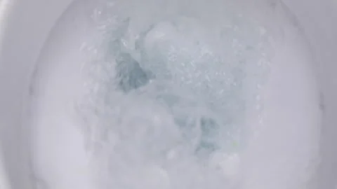 Toilet flushing process, close-up, slow motion, plumbing and house cleaning Stock Footage 147939913
