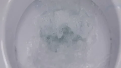 Toilet flushing process, close-up, slow motion, plumbing and house cleaning Stock Footage 147940135