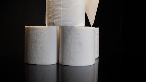 Toilet paper Tower stack on a spinning table close up Stock Footage 155130302