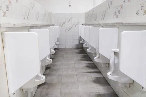 Toilets stood in a row for peeing Fotos de archivo