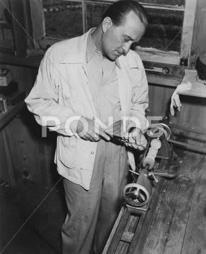 Toiling in workshop Stock Photos