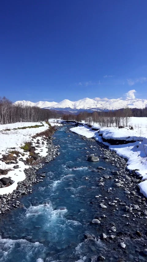 Tokachidake Mountain Range and the Blue Waters of Biei River Video stock 332304754