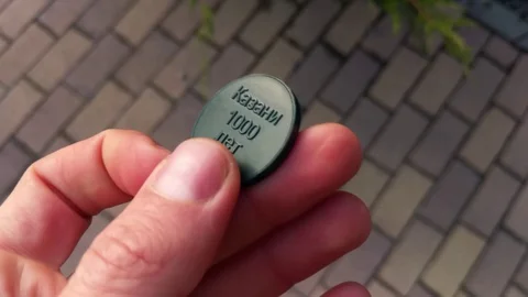 Token metro Kazan in hand Stock Footage 129521692