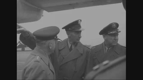 TOKYO - 1953: Command reception - Three officers confer on the tarmac 스톡 동영상 344500564
