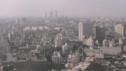 Tokyo - 1975: High-angle view of triangular building of Reiyukai Shakaden Temple Vídeos de archivo 232583597