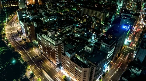 Tokyo - Aerial night city view with glowing light trails from traffic. 4K Stock Footage