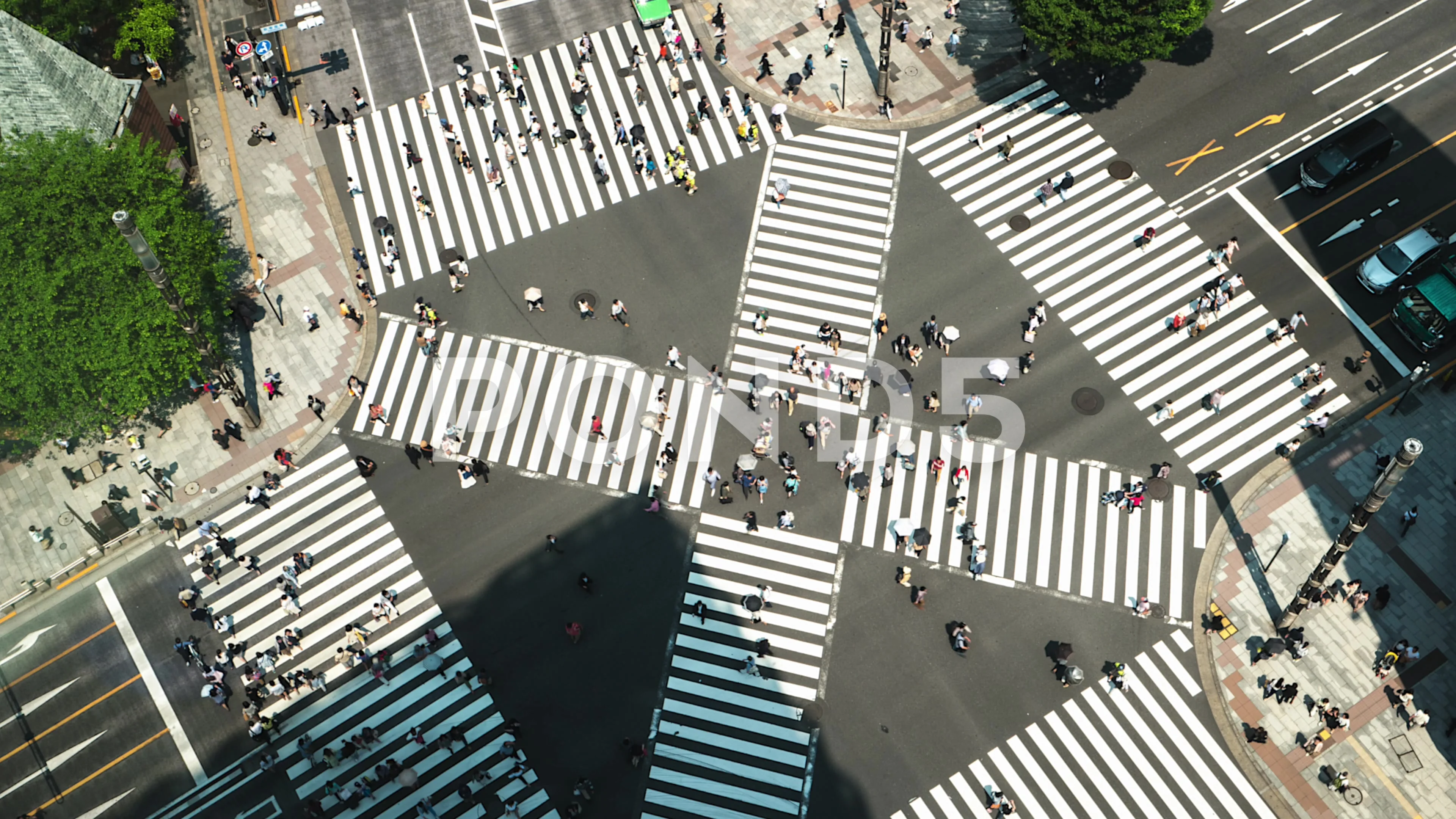 Tokyo aerial view of junction with traffic and people on crosswalk.4K time  lapse