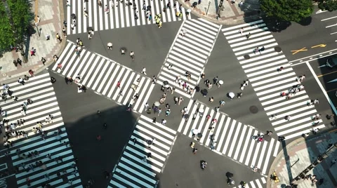 Tokyo - Aerial view of junction with traffic and people on crosswalk. 4K Stock Footage