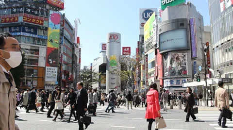 TOKYO - CIRCA MARCH 2013: Busy Shibuya intersection in Tokyo Stock Footage