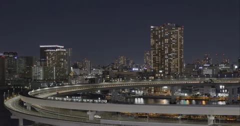 Tokyo cityscape night scene - Loop bridge traffic. Close-up Stock Footage 166327083