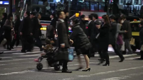 Tokyo commuters crossing busy intersection during rush hour .mp4 Stock Footage 59923441