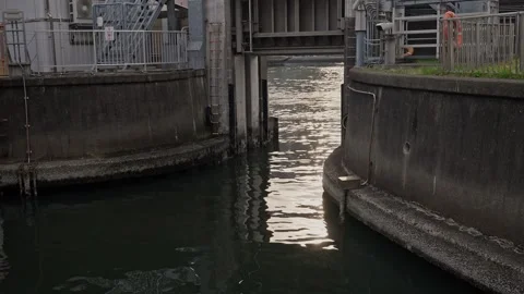 Tokyo Flood Gate Close-Up – Water Flowing Through Sumiyoshi Sluice Gate Opening Stock Footage 339758878