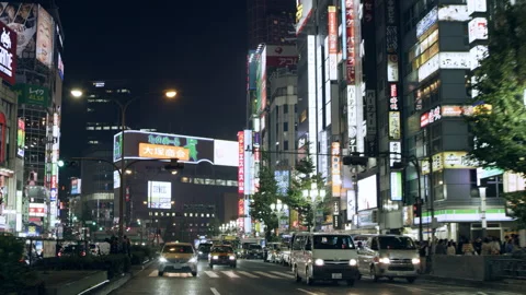 TOKYO, JAPAN - CIRCA October, 2018: Cars driving in a busy street past buildings Vídeos de archivo 199460157